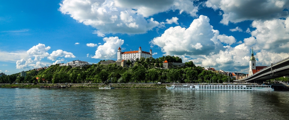 Panoramic view of Bratislava with the River Danube and the Castle atop the hill.